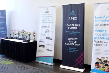 Display of awards with five banners around from sponsors